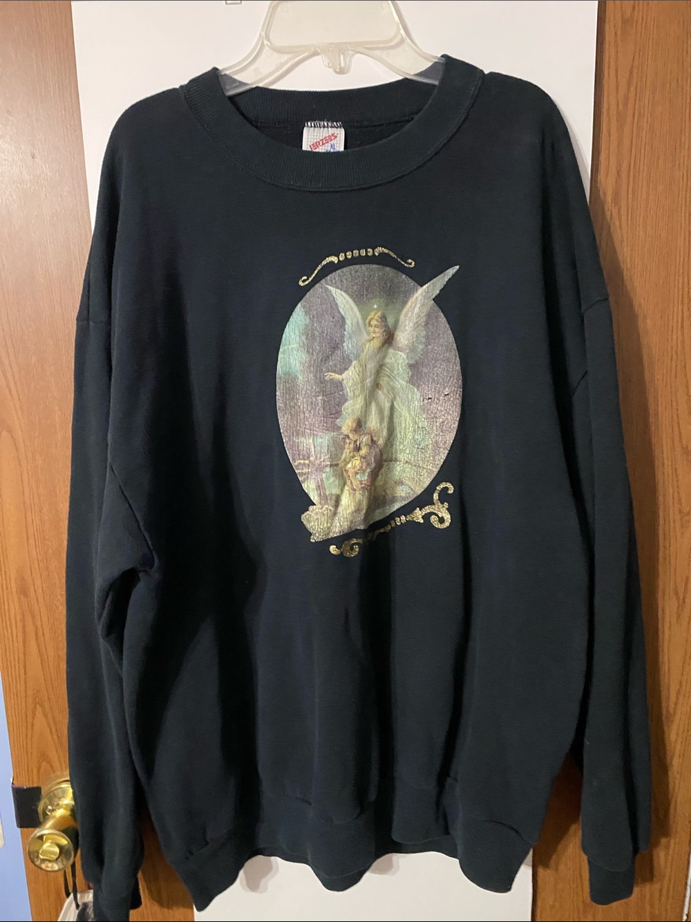 Vintage black sweatshirt with a a guardian angel on the front.